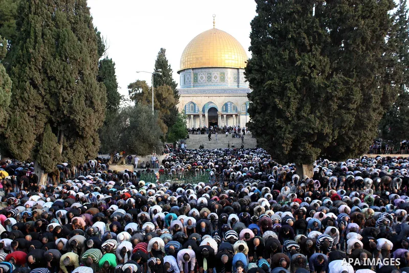 Palestinian Muslims attend prayers at the Al-Aqsa Mosque compound in Jerusalem on the first day of Eid al-Adha on Tuesday Nov. 16, 2010. Photo by Mohammed Alfateh