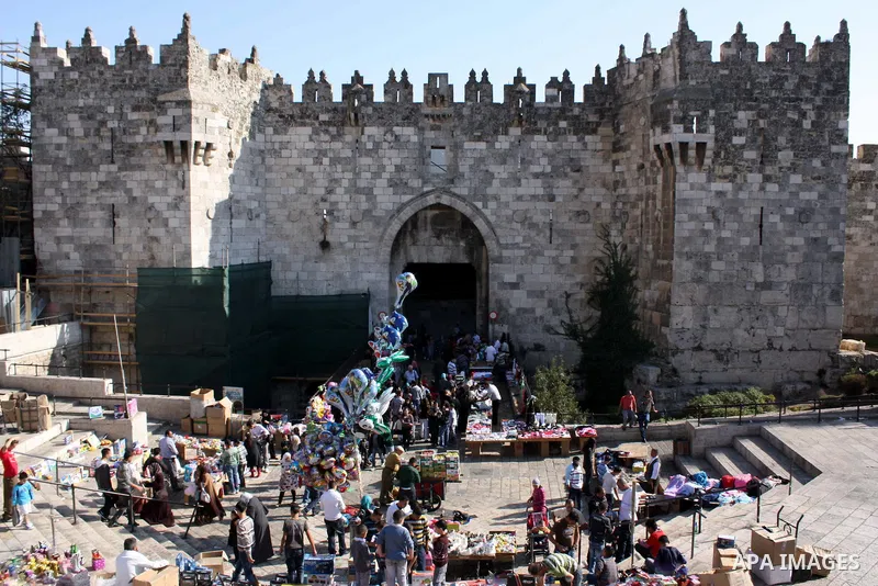 Palestinians celebrate in Jerusalem's old city on the second day of Eid al-Adha,on November, 17, 2010. as Muslims worldwide commemorate Eid al-Adha, or the Feast of the Sacrifice, marking the end of the hajj and commemor...