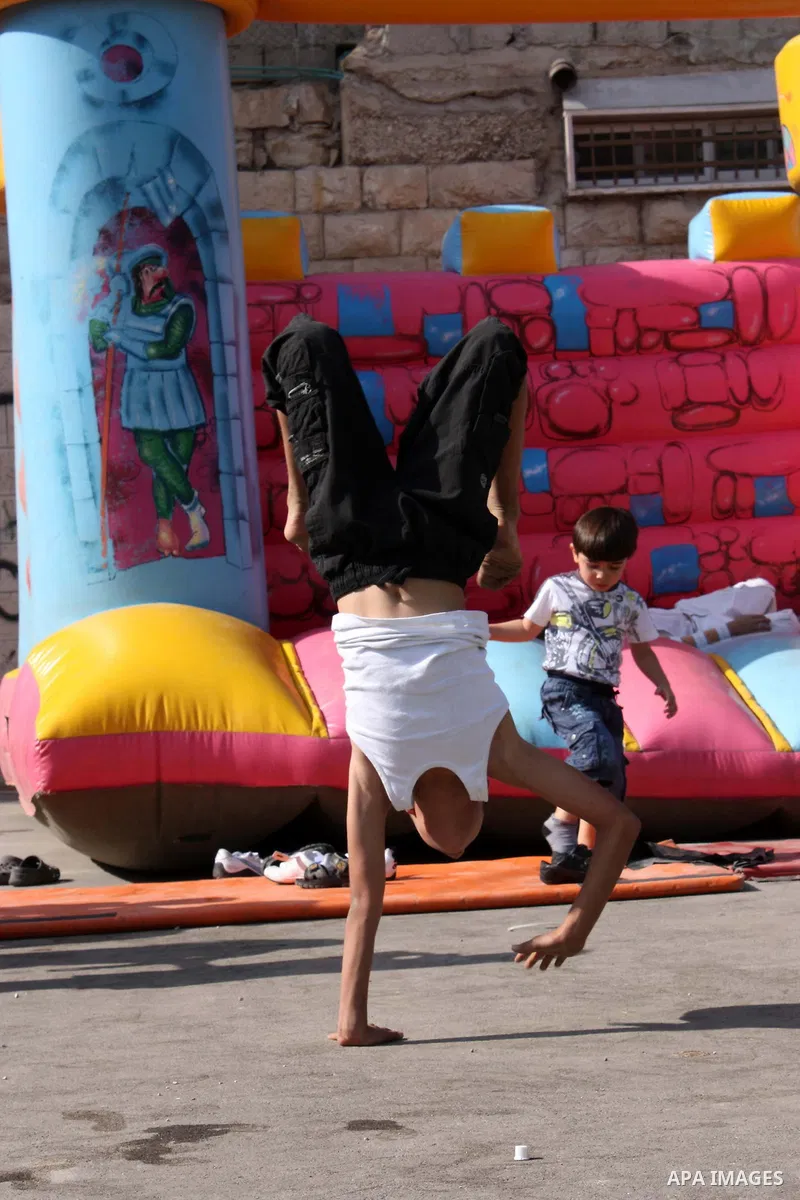 Palestinians enjoy in an amusement park in the Silwan neighborhood of East Jerusalem on the third day of Eid al-Adha,on November 18, 2010. as Muslims worldwide commemorate Eid al-Adha, or the Feast of the Sacrifice, mark...