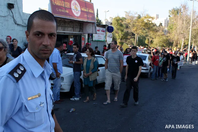 Left-wing Israelis and Palestinians protest against the Jewish takeover of Arab properties in the Sheikh Jarrah neighborhood of East Jerusalem on 19 November 2010. Several hundred people turned out today to protest the c...