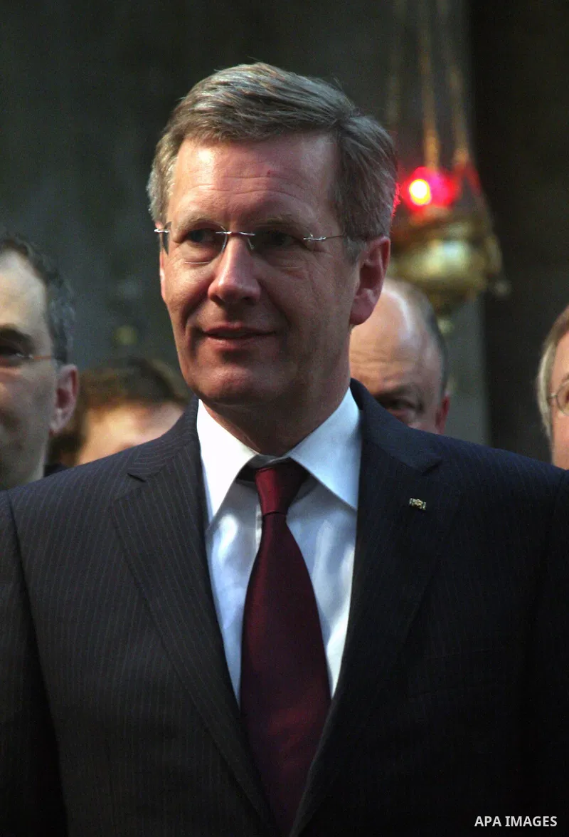 German President Christian Wulff (C) listens to an explanation as he visits the Church of the Nativity, believed to be by Christians the birthplace of Jesus Christ, in the West Bank city of Bethlehem on November 30, 2010...