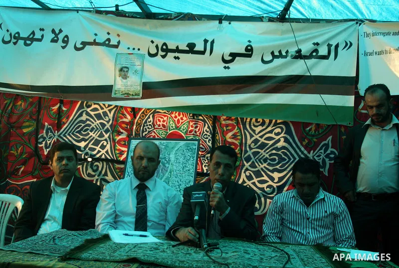 Palestinians attend a press conference against the demolition of houses by the Israeli Jews, at silwan tent, in the West Bank city of Jerusalem, on Dec. 2,2010. Photo by Mahfouz Abu Turk