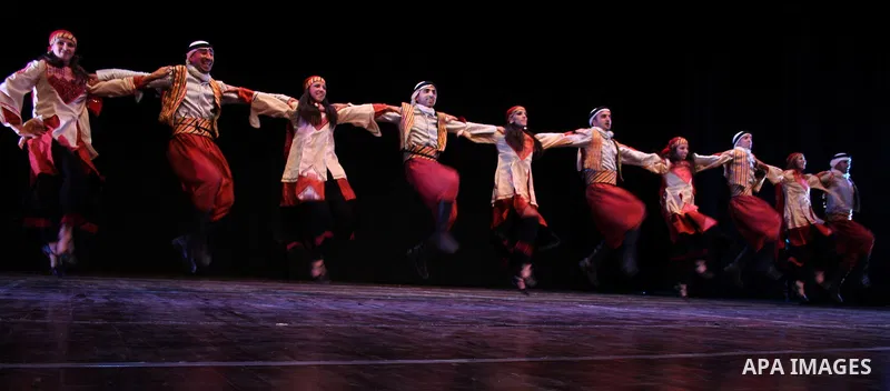 Palestinian dancers from the el-Wishah Popular Dance Troupe perform at a theatre in the West Bank city of Ramallah on Dec 2, 2010. Photo by Issam Rimawi