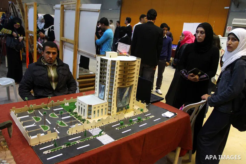 Palestinian youths display their designs during an exhibition at Al-shawwa theater in Gaza city on Dec. 6,2010.. Photo by Ashraf Amra