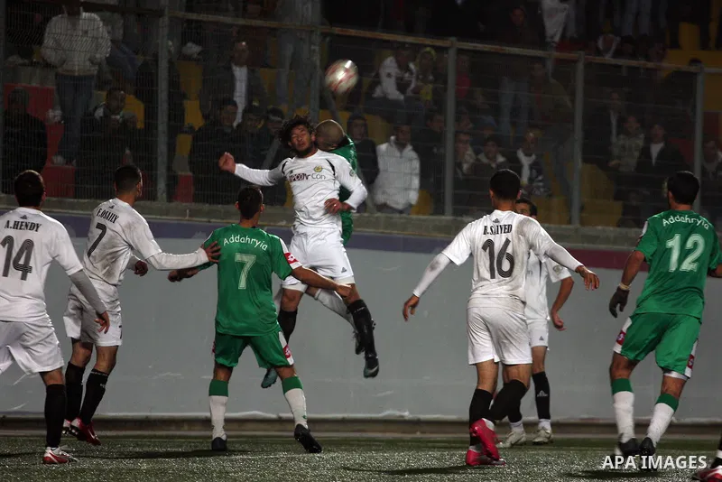 Football match between Hebron Youth Club, and the Club of Zahria(Green) in the Premier division games in the Faisal Husseini Stadium in Al-Ram north of Jerusalem,on December 18, 2010.Ended the match in a draw,(1-1). Phot...