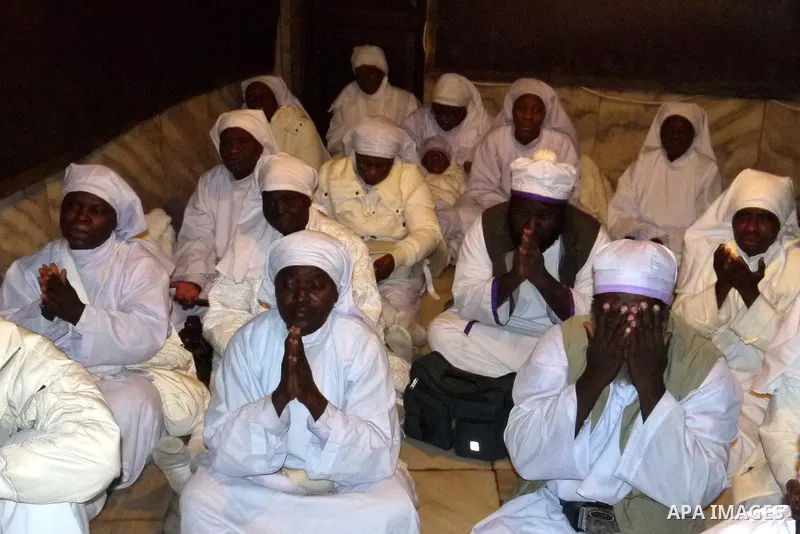 Nigerian Christian pilgrims gather for prayers at the Church of the Nativity, believed to be the birthplace of Jesus Christ, in the West Bank town of Bethlehem on December 24, 2010 as the Holy Land prepared to mark Chris...