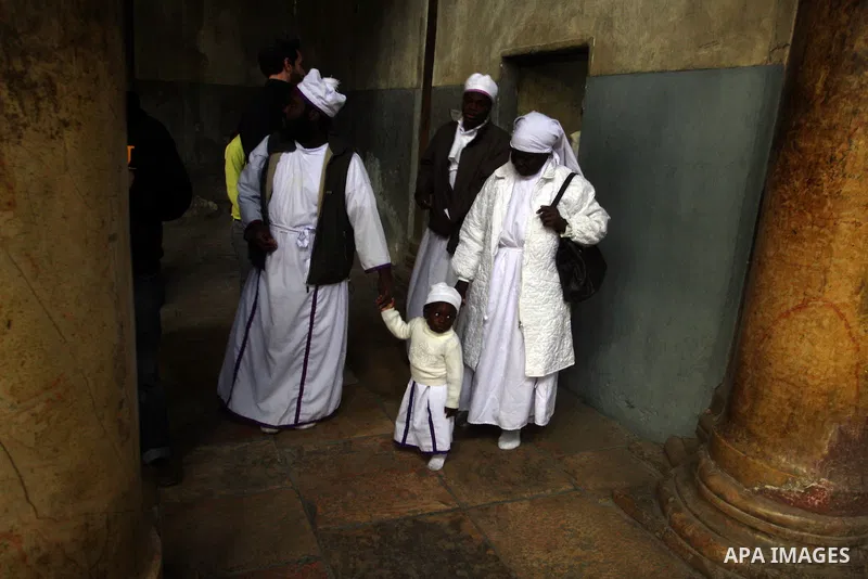 Nigerian Christian pilgrims gather for prayers at the Church of the Nativity, believed to be the birthplace of Jesus Christ, in the West Bank town of Bethlehem on December 24, 2010 as the Holy Land prepared to mark Chris...