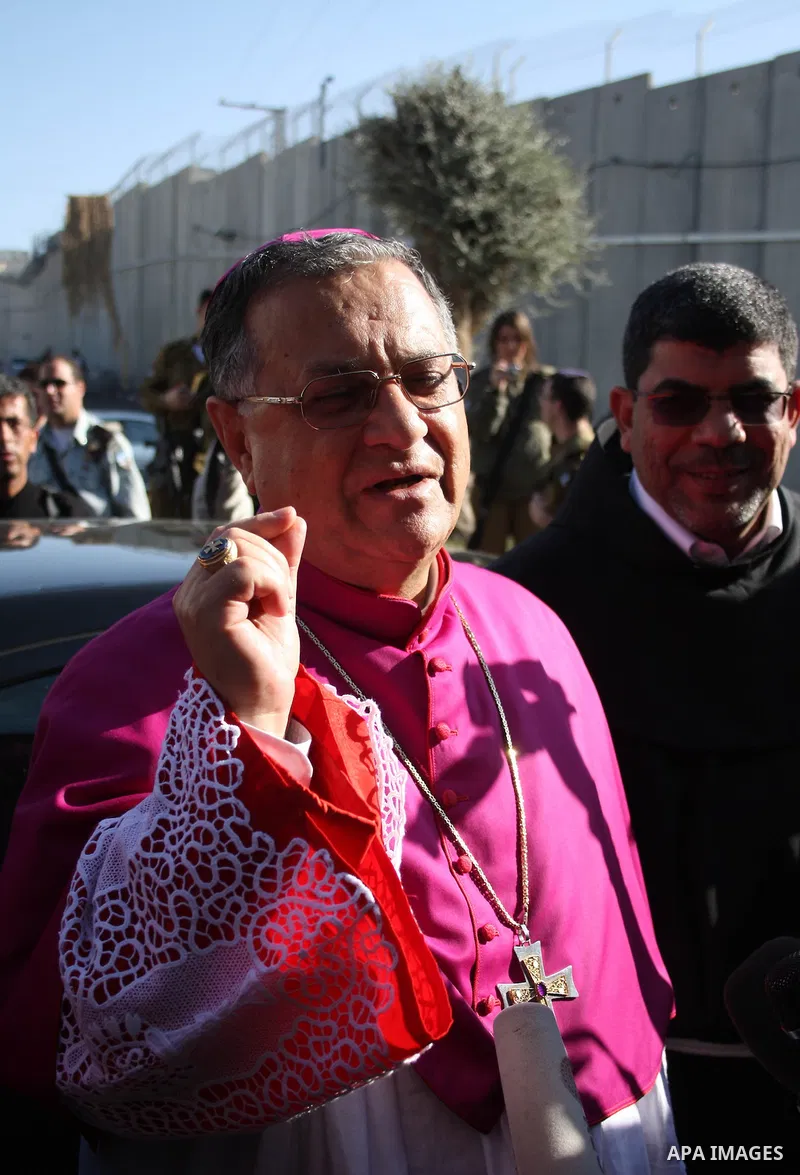 The Latin Patriarch of Jerusalem Fouad Twal arrives to the West Bank city of Bethlehem December 24, 2010. Twal crossed from Jerusalem into Bethlehem through a checkpoint on Thursday to attend an annual Christmas processi...