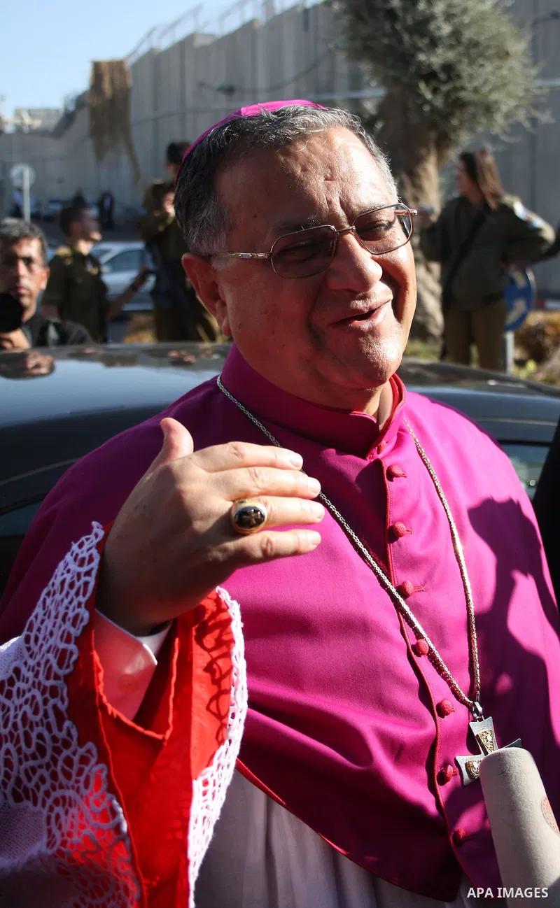 The Latin Patriarch of Jerusalem Fouad Twal arrives to the West Bank city of Bethlehem December 24, 2010. Twal crossed from Jerusalem into Bethlehem through a checkpoint on Thursday to attend an annual Christmas processi...