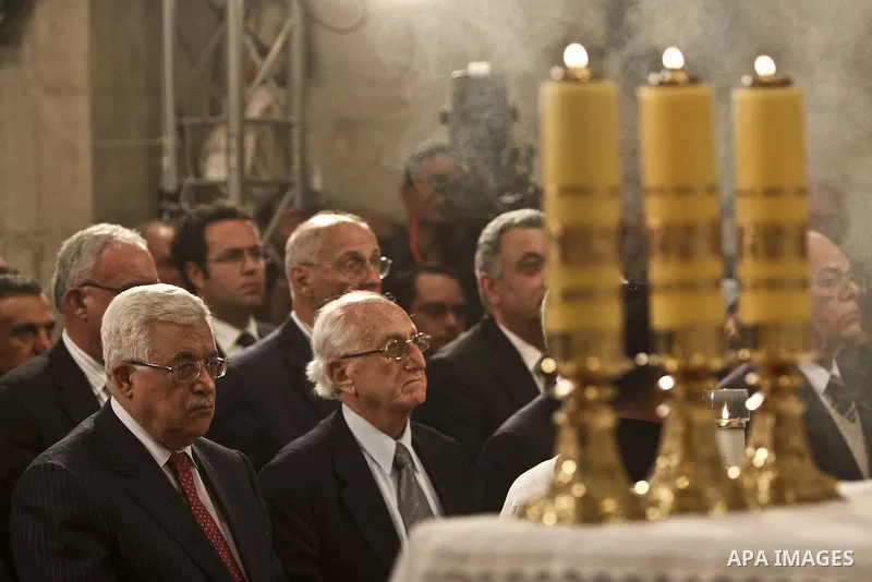 Palestinian President Mamoud Abbas (L) Attends Christmas midnight mass at the Church of the Nativity in the West Bank town of Bethlehem early Dec. 25, 2010. Leaded by Latin Patriarch of Jerusalem Fouad Twal. Photo by Fad...