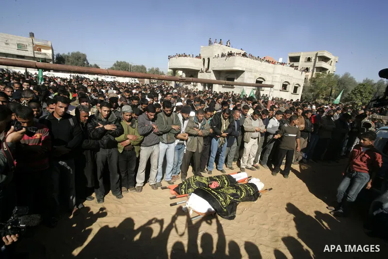 Palestinians pray over the bodies of Islamic Jihad militants Mahmud Al-Najjar and Musaab Abu Rock, who were killed in an exchange of fire with Israeli soldiers on the border of Gaza, during their funeral in Khan Yunis, s...