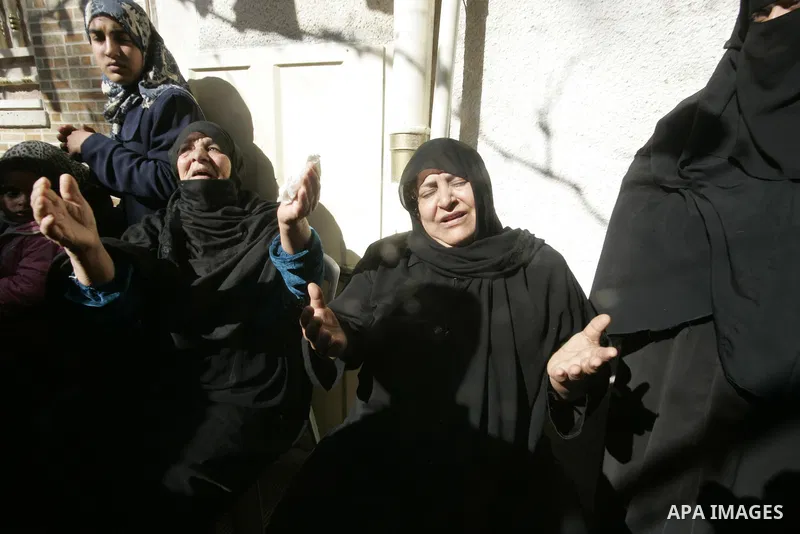 Palestinian relatives mourn over the body Mahmud Alnajjar fighter of Islamic Jihad during their funeral in Khan Yunis, southern Gaza Strip on December 26, 2010. Israeli forces killed two Palestinian militants Sunday morn...
