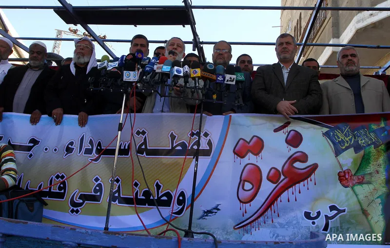 Palestinian supporters of Islamic Jihad protest during a demonstration marking the 2nd anniversary of the Israel-Gaza war, in the Jebaliya refugee camp, northern Gaza Strip, Monday, Dec. 27, 2010. Israel's volatile front...