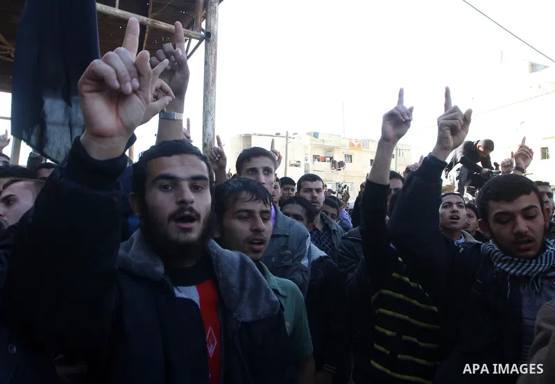 Palestinian supporters of Islamic Jihad protest during a demonstration marking the 2nd anniversary of the Israel-Gaza war, in the Jebaliya refugee camp, northern Gaza Strip, Monday, Dec. 27, 2010. Israel's volatile front...