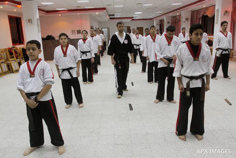 The Palestinian champion in Nunchaku sport, Eyad Arafat during his training for Nunchaku students in Al-Ahly club in Gaza City on Dec. 28,2010. Eyad Arafat is a world champion and founder of a Palestinian way in the Nunc...