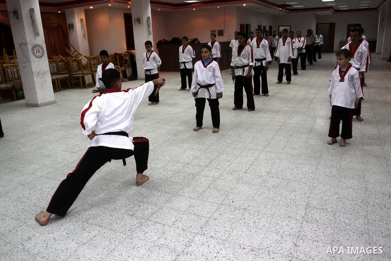 The Palestinian champion in Nunchaku sport, Eyad Arafat during his training for Nunchaku students in Al-Ahly club in Gaza City on Dec. 28,2010. Eyad Arafat is a world champion and founder of a Palestinian way in the Nunc...