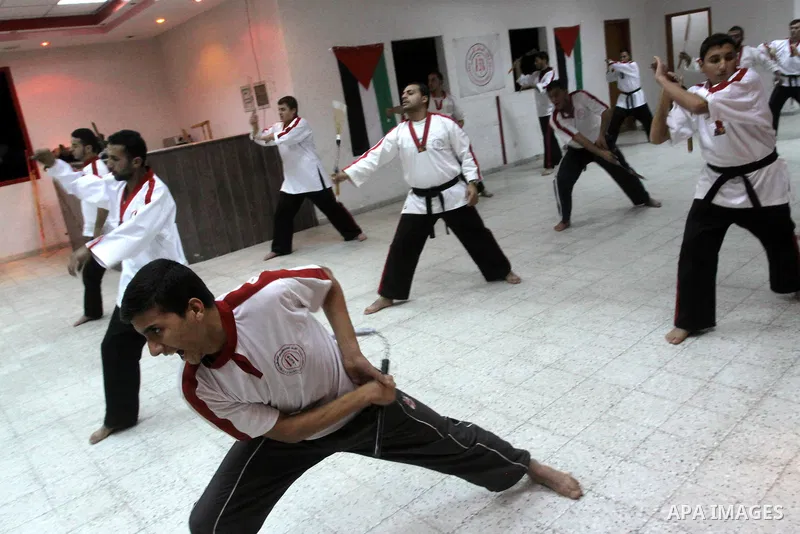 The Palestinian champion in Nunchaku sport, Eyad Arafat during his training for Nunchaku students in Al-Ahly club in Gaza City on Dec. 28,2010. Eyad Arafat is a world champion and founder of a Palestinian way in the Nunc...