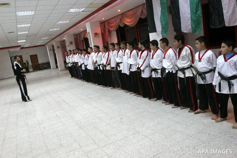 The Palestinian champion in Nunchaku sport, Eyad Arafat during his training for Nunchaku students in Al-Ahly club in Gaza City on Dec. 28,2010. Eyad Arafat is a world champion and founder of a Palestinian way in the Nunc...