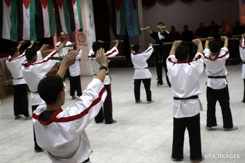 The Palestinian champion in Nunchaku sport, Eyad Arafat during his training for Nunchaku students in Al-Ahly club in Gaza City on Dec. 28,2010. Eyad Arafat is a world champion and founder of a Palestinian way in the Nunc...