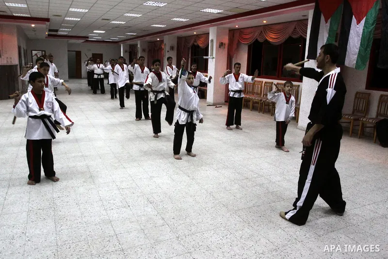 The Palestinian champion in Nunchaku sport, Eyad Arafat during his training for Nunchaku students in Al-Ahly club in Gaza City on Dec. 28,2010. Eyad Arafat is a world champion and founder of a Palestinian way in the Nunc...