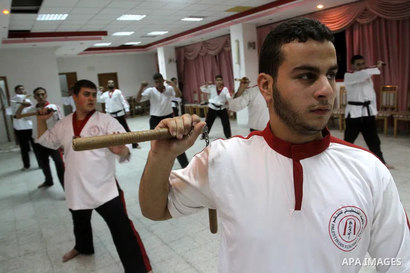 The Palestinian students in Nunchaku sport during their training headed by Eyad Arafat at Al-Ahly club in Gaza City on Dec. 28,2010. Eyad Arafat is a world champion and founder of a Palestinian way in the Nunchaku sport....