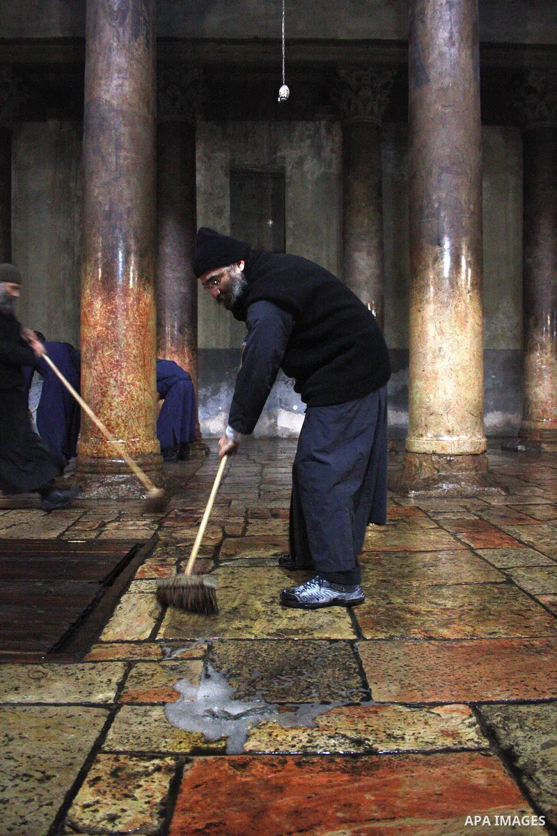 Orthodox priests clean the Church of the Nativity in the biblical West Bank city of Bethlehem on December 30, 2010 as part of the preparations for the Orthodox faith's Christmas celebrations. The Orthodox faith in the ho...