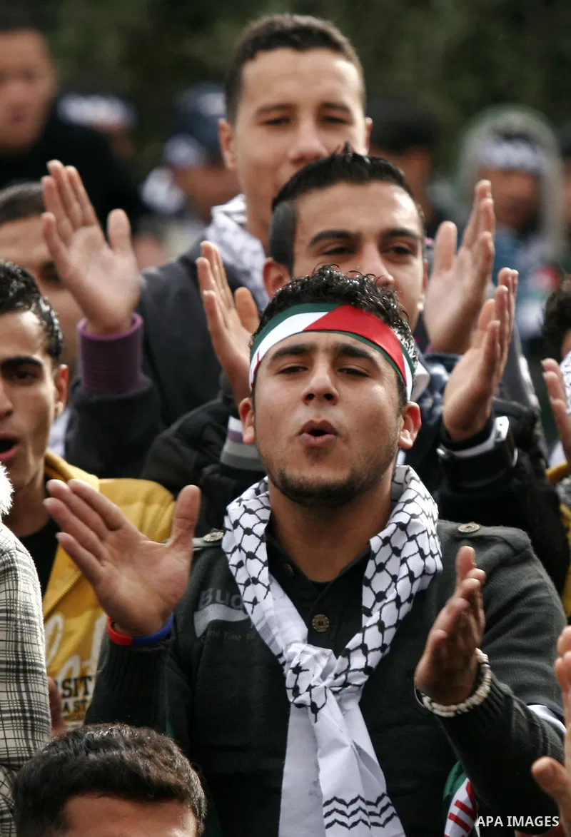 Palestinian Fatah supporters gather during a rally to mark the upcoming 46th anniversary since the group's foundation in the West Bank town of Toura Al-Gharbeyyeh, near Jenin, Saturday, Jan. 1, 2011. Photo by Wagdi Eshta...
