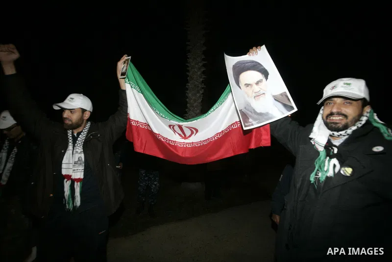 Pro-Palestinian activists from Asia 1 convoy hold the Iranian flag upon their arrival to the Gaza Strip through Rafah border crossing between Egypt and southern Gaza Strip, Jan. 3, 2011. The Asia 1 convoy, gathering 170...