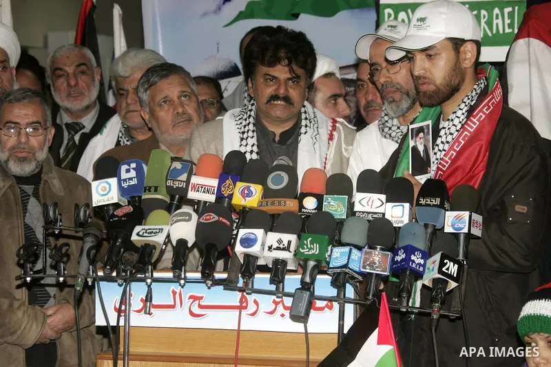 Pro-Palestinian activists from Asia 1 convoy attend a press conference upon their arrival to the Gaza Strip through Rafah border crossing between Egypt and southern Gaza Strip, Jan. 3, 2011. The Asia 1 convoy, gathering...