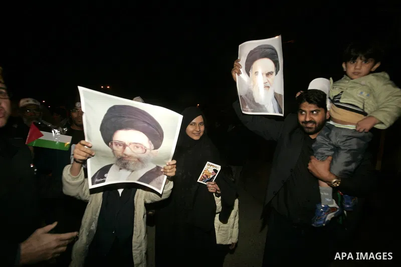Pro-Palestinian activists from Asia 1 convoy hold pictures of leader of the 1979 Iranian Revolution ,Khomeini upon their arrival to the Gaza Strip through Rafah border crossing between Egypt and southern Gaza Strip, Jan....