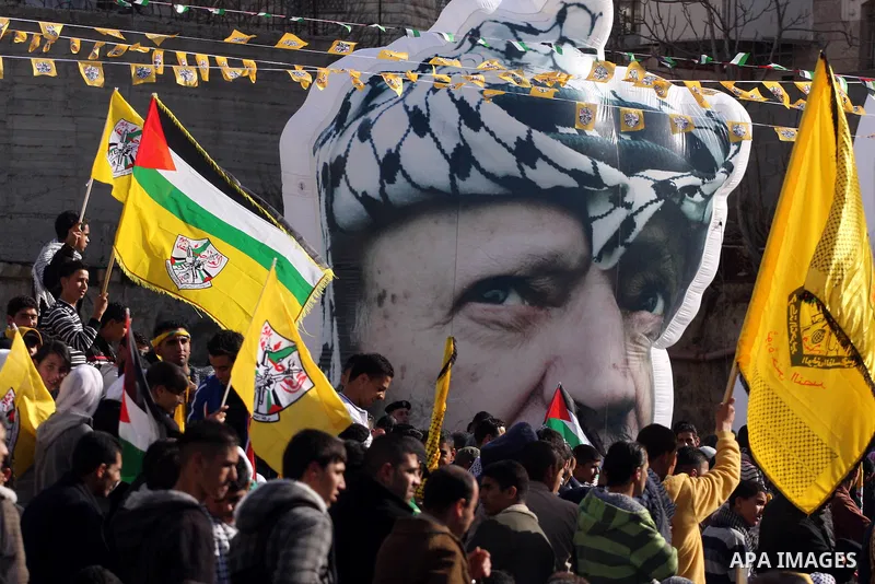 Palestinians take part in the celebrations marking the 46th anniversary of the creation of their Fatah movement in the West Bank city of Ramallah on January 3, 2011. The secular Fatah movement was founded by the iconic l...