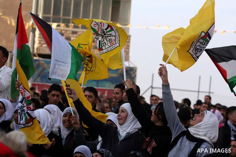 Palestinians take part in the celebrations marking the 46th anniversary of the creation of their Fatah movement in the West Bank city of Ramallah on January 3, 2011. The secular Fatah movement was founded by the iconic l...