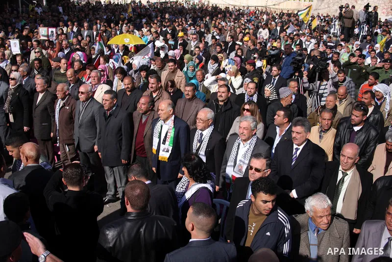 Palestinians take part in the celebrations marking the 46th anniversary of the creation of their Fatah movement in the West Bank city of Ramallah on January 3, 2011. The secular Fatah movement was founded by the iconic l...