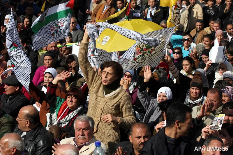 Palestinians take part in the celebrations marking the 46th anniversary of the creation of their Fatah movement in the West Bank city of Ramallah on January 3, 2011. The secular Fatah movement was founded by the iconic l...