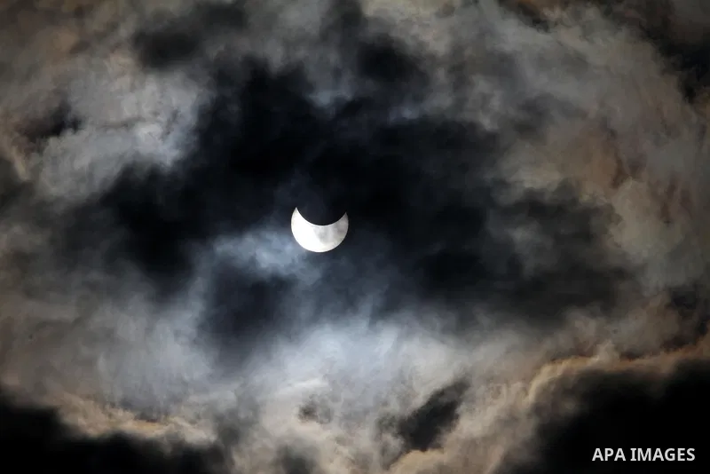 Picture shows the sun partially blocked by the moon, during a partial solar eclipse, in Gaza City on Tuesday 04 January 2011. The partial eclipse was visible near sunrise over most of Europe and northeastern Asia on Tues...