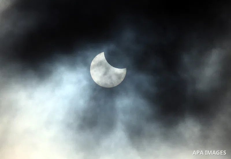 A partial solar eclipse is seen from Ramallah, in the west bank ,January 4, 2011. The partial eclipse was visible near sunrise over most of Europe and northeastern Asia on Tuesday. Photo by Issam Rimawi