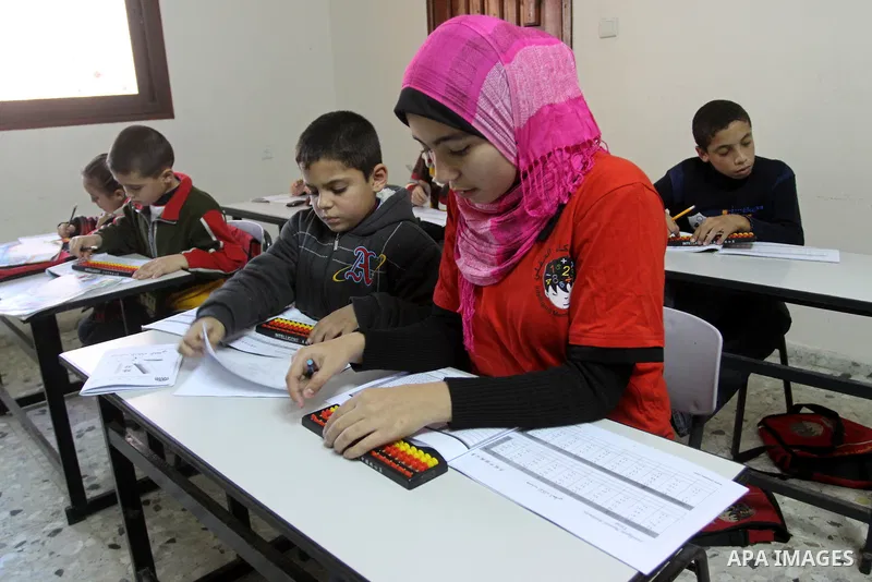 A Palestinian schoolgirl, Meyer-Tai, 14 years old attends a lesson at Intelligent Mental-Arithmetic school, in Gaza City on Jan. 3,2010. Meyer-Tai, has won the fourth place in the world competition Intelligent Mental-Ari...