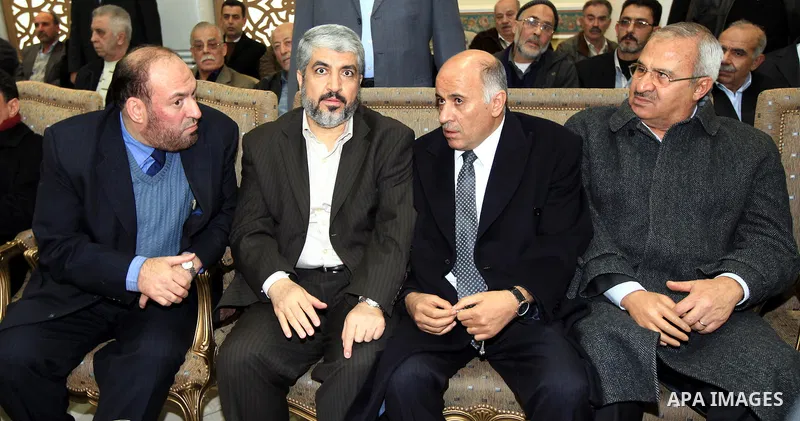The head of the Hamas political bureau, Khaled Mashaal offers his condolence on the death of the elder brother of the Palestinian President Mahmoud Abbas in Damascus on Jan. 4,2011. Photo by STR
