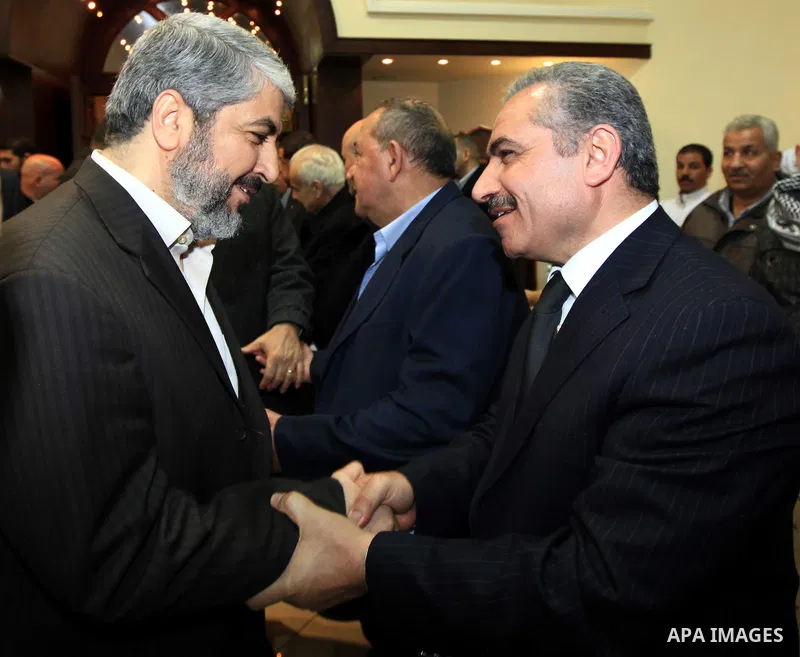 The head of the Hamas political bureau, Khaled Mashaal offers his condolence on the death of the elder brother of the Palestinian President Mahmoud Abbas in Damascus on Jan. 4,2011. Photo by STR