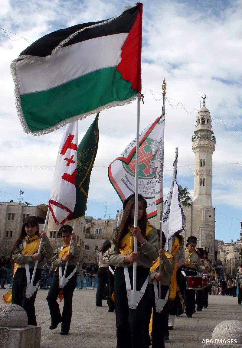 Palestinian scout drummers as they line up in Manger Square before the Church of the Nativity, the traditionally accepted birth place of Jesus Christ, as they annual Christmas eve procession celebration gets underway cel...
