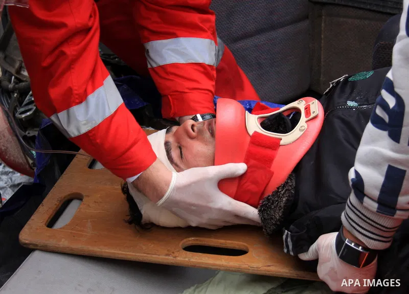 Palestinian red crescent members stage a mock rescue operation during a training an emergency evacuation , in the West Bank city of Qalqilya, Thursday, Jan. 6, 2011. Photo by Wagdi Eshtayah