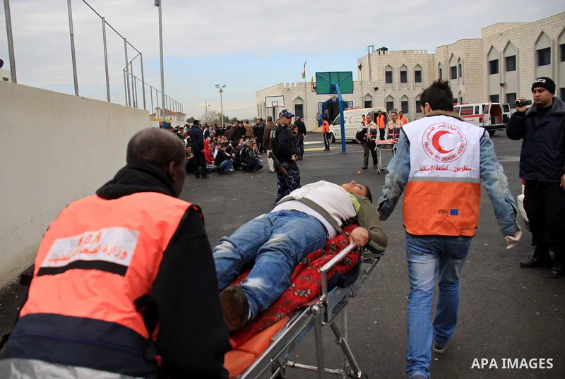 Palestinian red crescent members stage a mock rescue operation during a training an emergency evacuation , in the West Bank city of Qalqilya, Thursday, Jan. 6, 2011. Photo by Wagdi Eshtayah