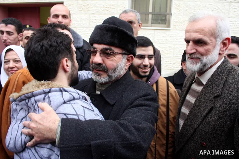Palestinians greet the six Hamas detainees who refrained from eating for 45 days after they released from a Palestinian Authority prison according to Palestinian President Mahmoud Abbas' order, in the West Bank city of H...