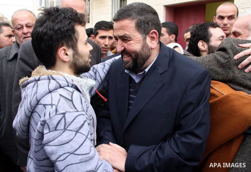 Palestinians greet the six Hamas detainees who refrained from eating for 45 days after they released from a Palestinian Authority prison according to Palestinian President Mahmoud Abbas' order, in the West Bank city of H...