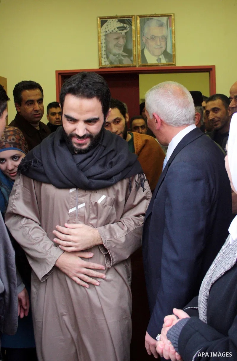 Palestinians greet the six Hamas detainees who refrained from eating for 45 days after they released from a Palestinian Authority prison according to Palestinian President Mahmoud Abbas' order, in the West Bank city of H...
