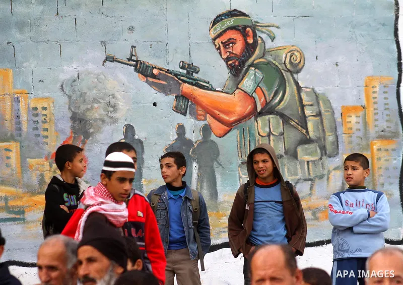 Palestinians take part in a rally organised by Hamas marking the second anniversary of the Israel-Gaza war in the Jabalia refugee camp in the northern Gaza Strip on January 6, 2011. Photo by Ashraf Amra