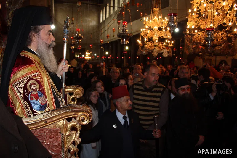 Greek Orthodox Patriarch of Jerusalem Theofilos III waves a censer as he stand in the Nativity church during the Greek Orthodox Christmas Eve in the West Bank city of Bethlehem, Thursday, Jan. 6, 2011. Christmas falls on...