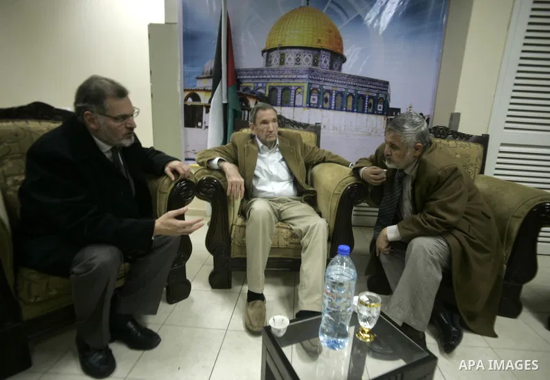 Palestinian Prime Minister adviser, Ahmed Yousef meets with former US attorney general Ramsey Clark at Rafah crossing border between Egypt and Gaza while Clark leaves the Gaza Strip After his visit to the enclave strip o...