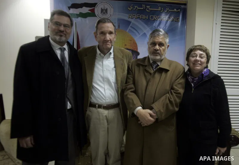 Palestinian Prime Minister adviser, Ahmed Yousef meets with former US attorney general Ramsey Clark at Rafah crossing border between Egypt and Gaza while Clark leaves the Gaza Strip After his visit to the enclave strip o...