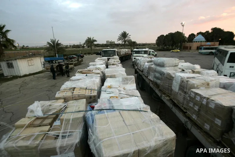 Palestinian trucks carrying aid Asia 1 reach the Gaza Strip through the Rafah crossing border between Egypt and Gaza after the Egyptian authorities allowed for the aids to enter Gaza Strip on January 6, 2011. Photo by Ab...